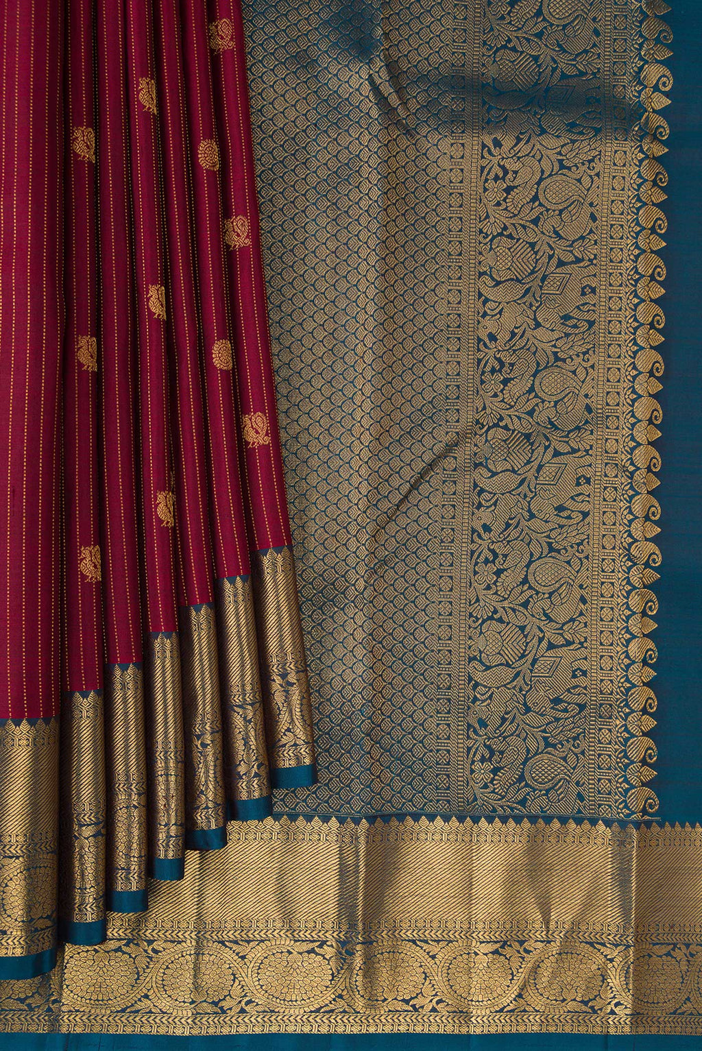 Pleats and pallu of Pure Silk Red Kanjivaram Saree with Stripes on the body and Zari Border. 