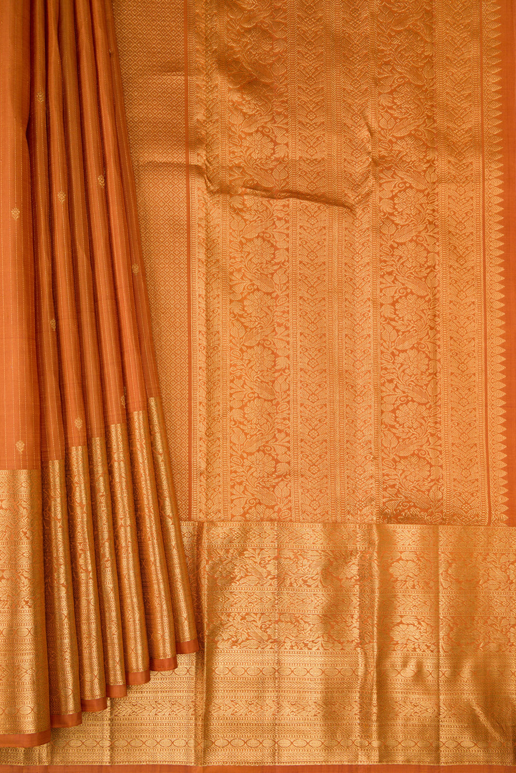Pleats and pallu of Mustard Kanjivaram Silk Saree with Stripes on the body and Zari Border. 