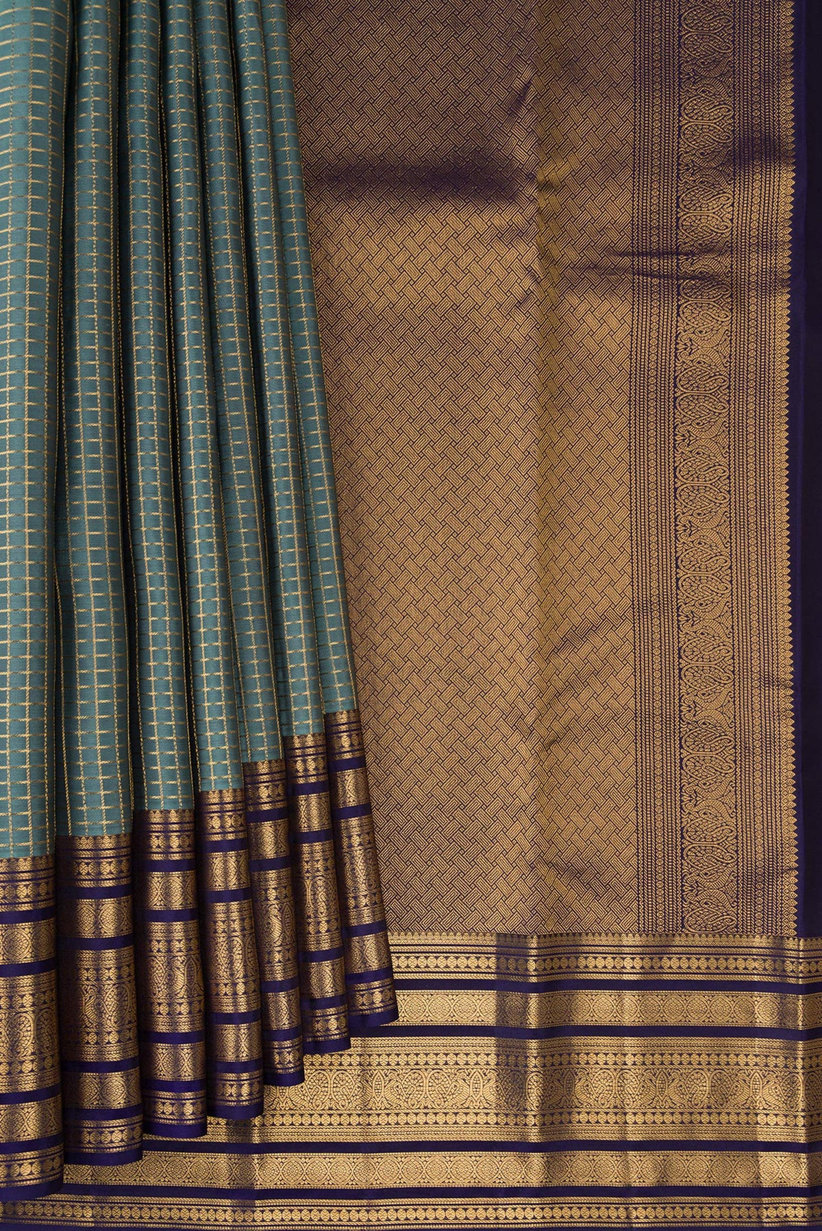 Pleats and pallu of Grey Kanjivaram Silk Saree with Checked design on the body and Fancy Border. 