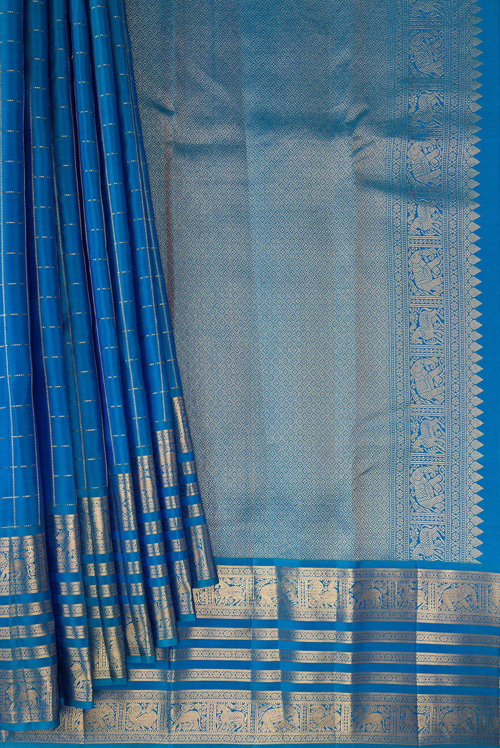 Pleats and pallu of Pure Silk Peacock Blue Kanjivaram Saree with Checked design on the body and Zari Border. 