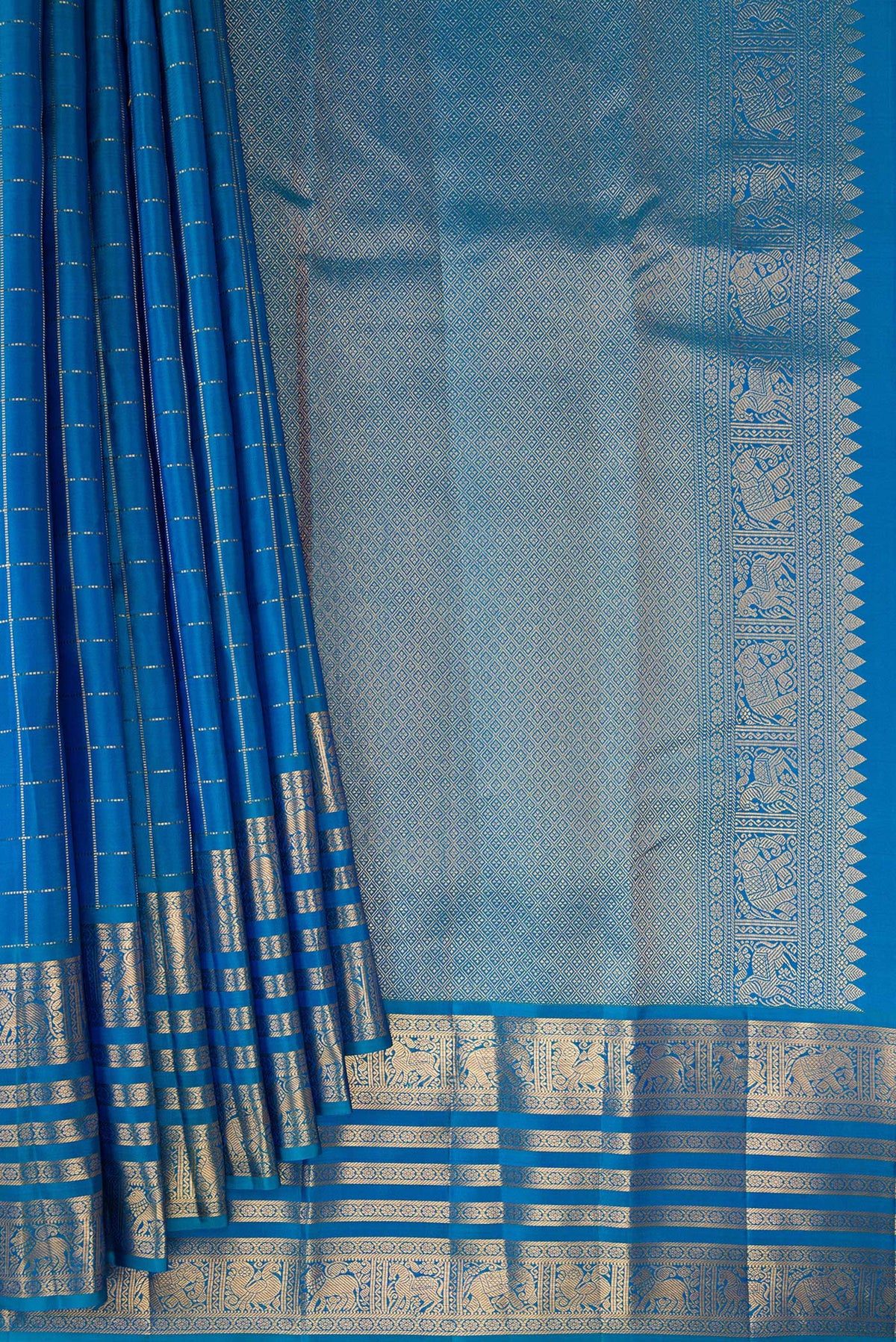Pleats and pallu of Pure Silk Peacock Blue Kanjivaram Saree with Checked design on the body and Zari Border. 
