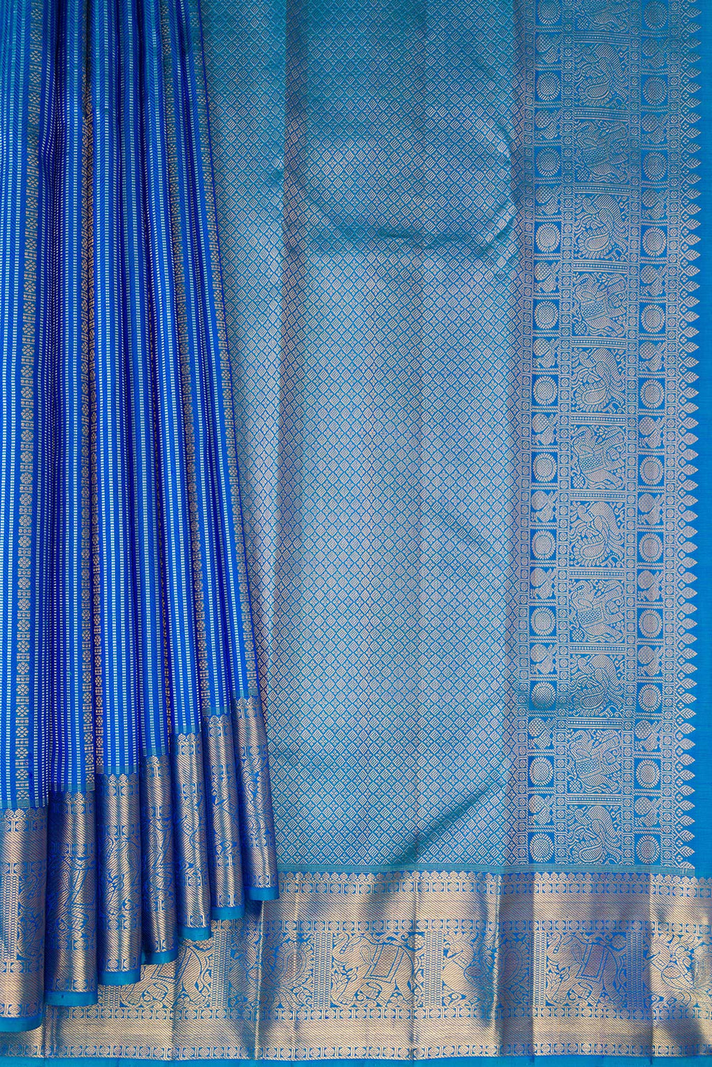Pleats and pallu of Peacock Blue Dual Tone Kanjivaram Silk Saree with Stripes on the body and Zari Border. 