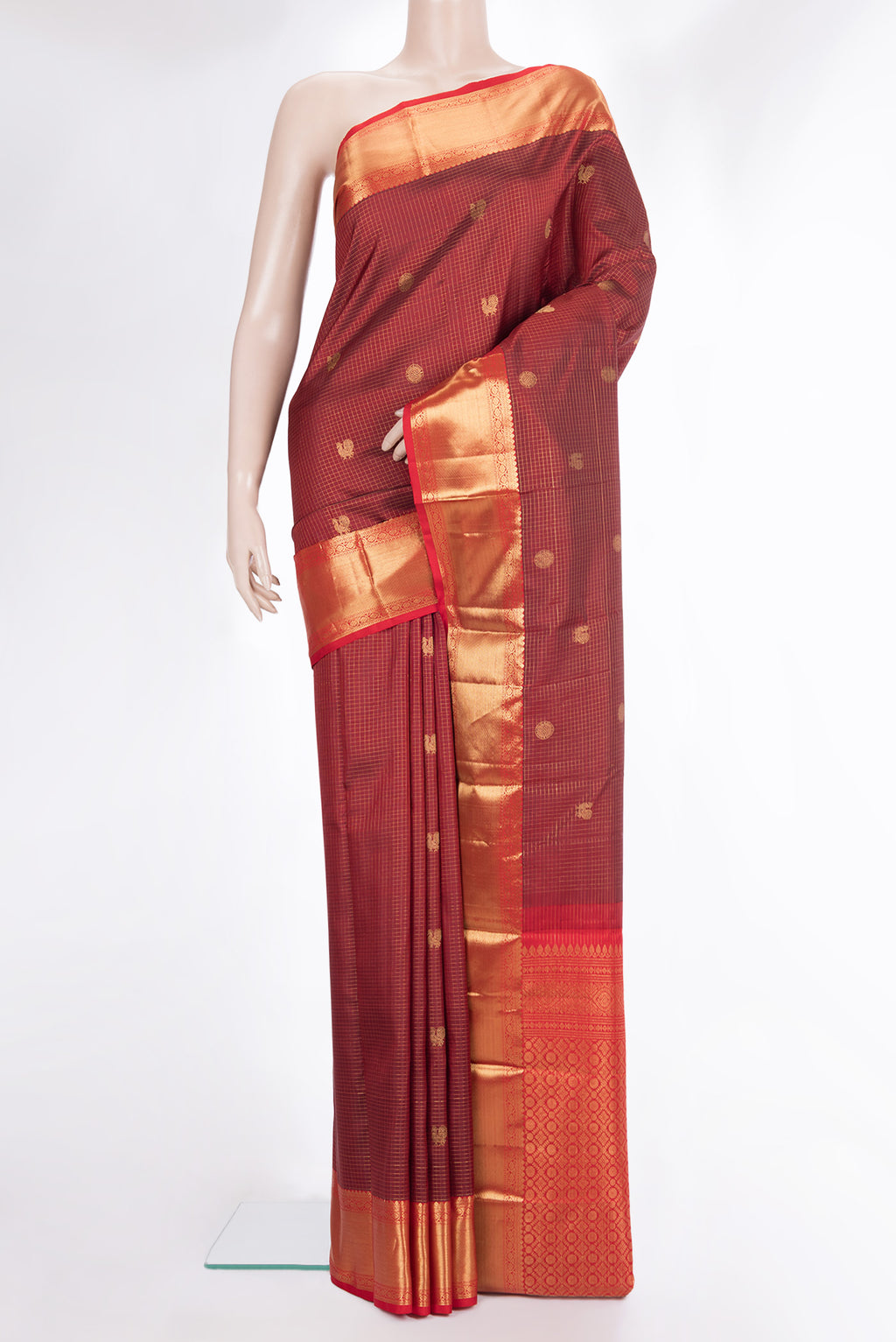 Pure Silk Maroon Kanjivaram Saree with Checked design on the body and Zari Border.  displayed on a mannequin