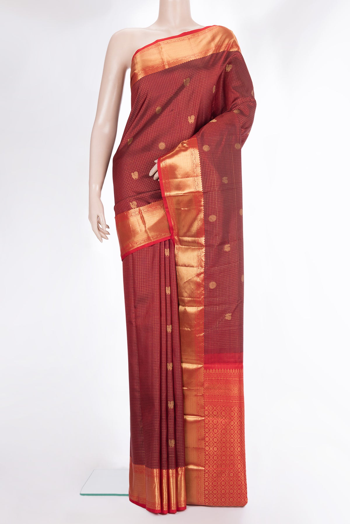 Pure Silk Maroon Kanjivaram Saree with Checked design on the body and Zari Border.  displayed on a mannequin