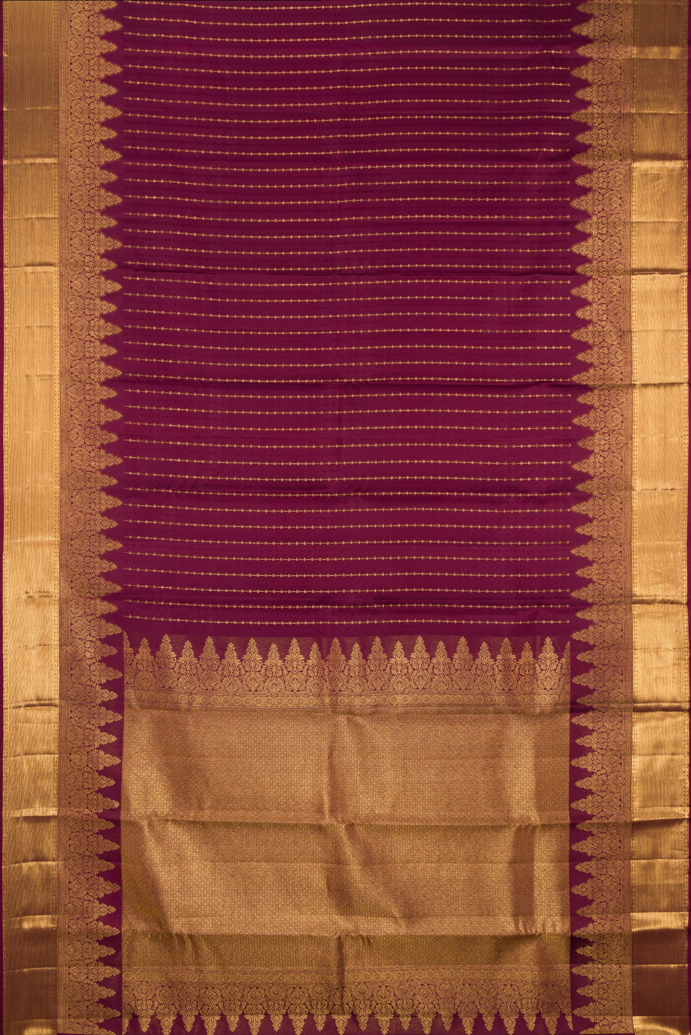 Flat view of Burgundy Kanjivaram Silk Saree with Zari Butta on the body and Zari Border. 