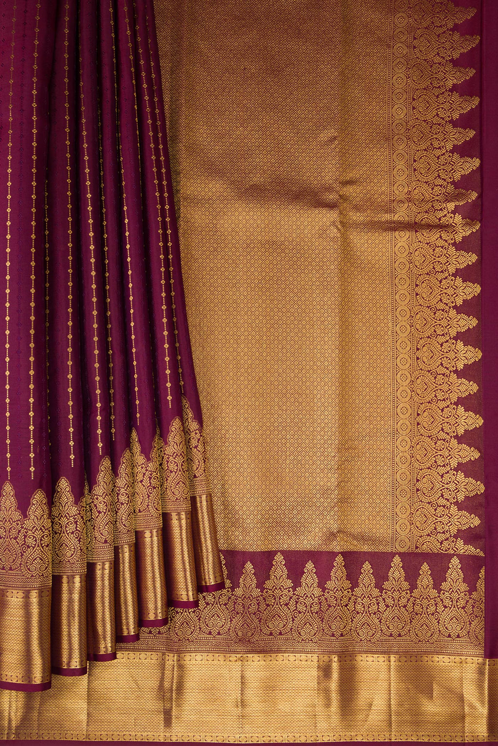 Pleats and pallu of Burgundy Kanjivaram Silk Saree with Zari Butta on the body and Zari Border. 
