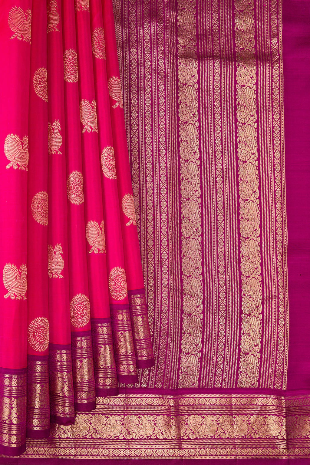 Pleats and pallu of Dark Pink Kanjivaram Silk Saree with Zari Butta on the body and Zari Border. 