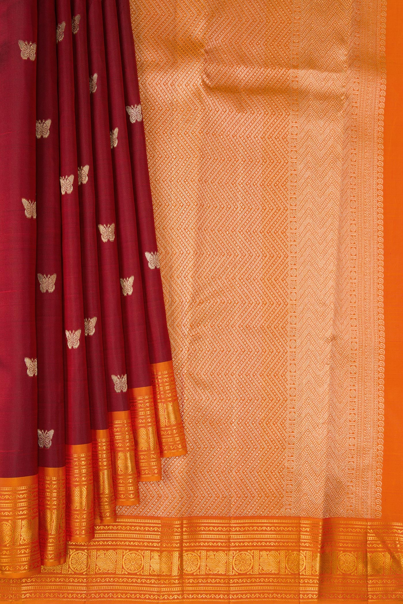 Pleats and pallu of Maroon Kanjivaram Silk Saree with Zari Butta on the body and Zari Border. 
