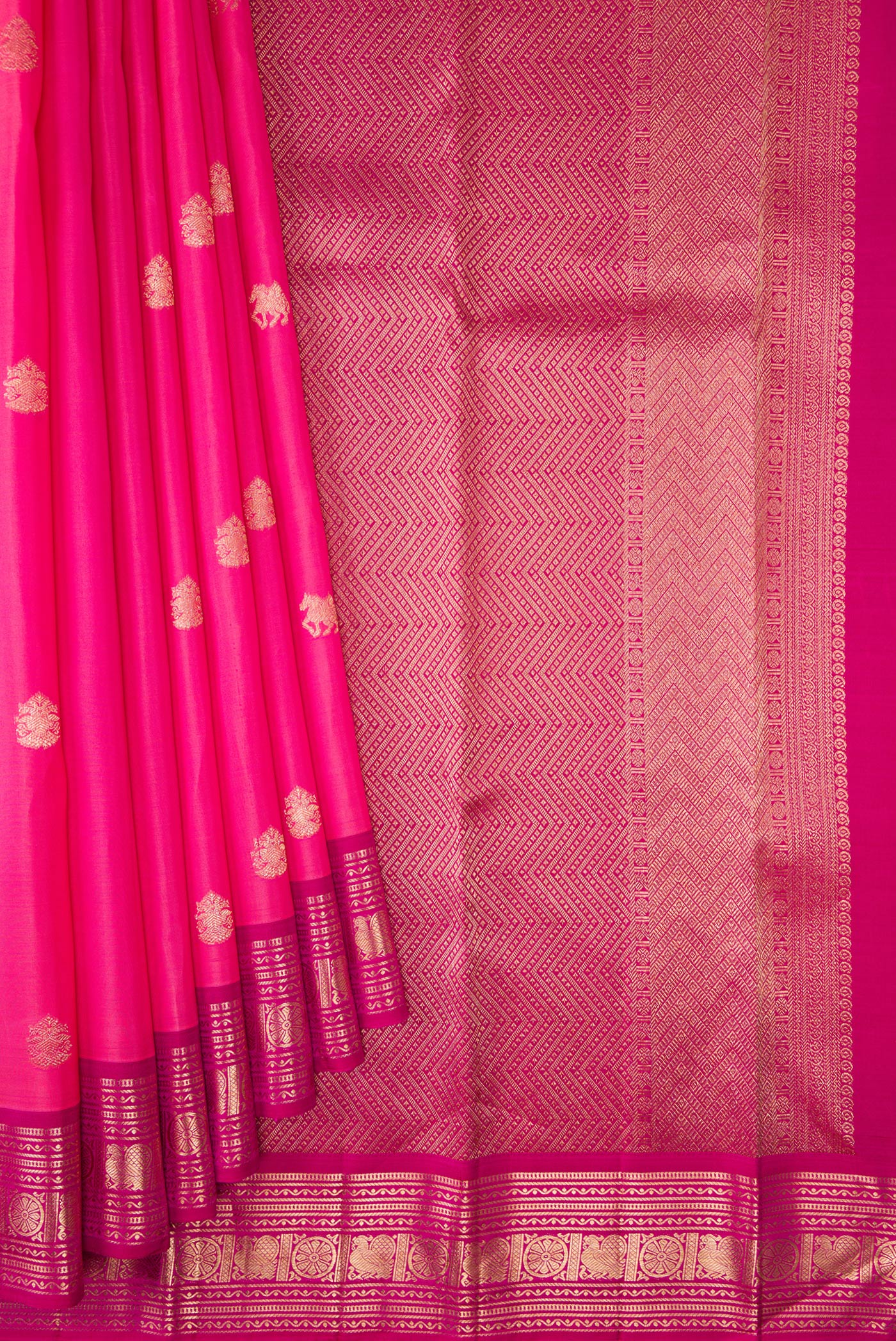 Pleats and pallu of Pink Kanjivaram Silk Saree with Zari Butta on the body and Zari Border. 
