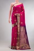 Dark Pink Kanjivaram Silk Saree with Zari Butta on the body and Zari Border.  displayed on a mannequin