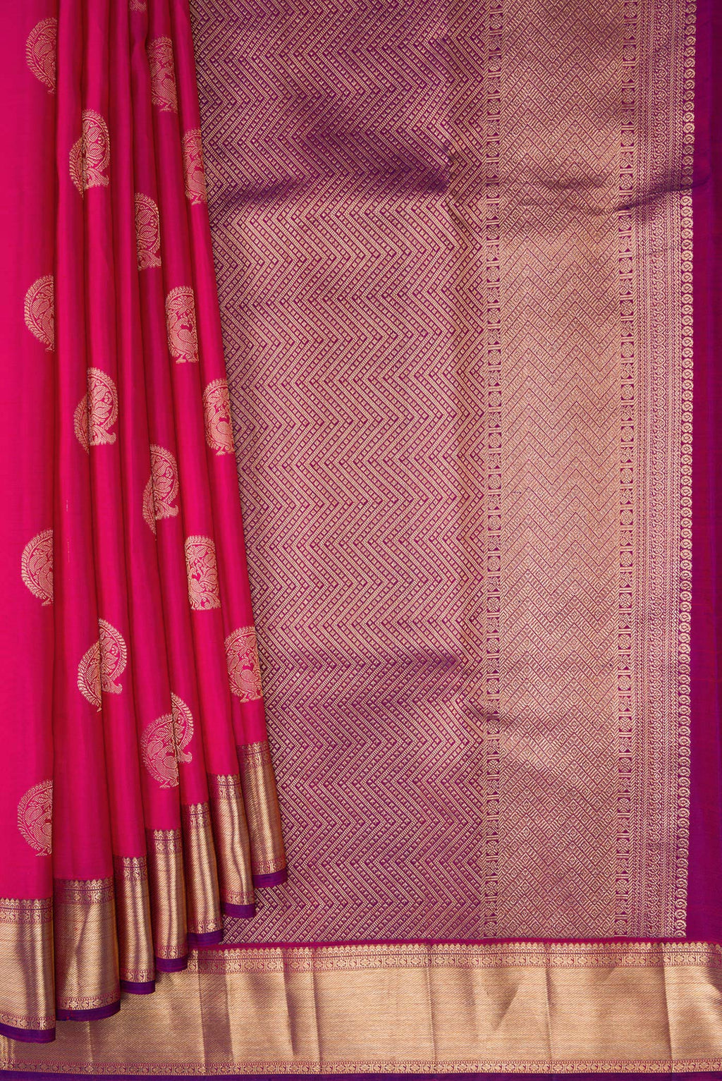 Pleats and pallu of Dark Pink Kanjivaram Silk Saree with Zari Butta on the body and Zari Border. 