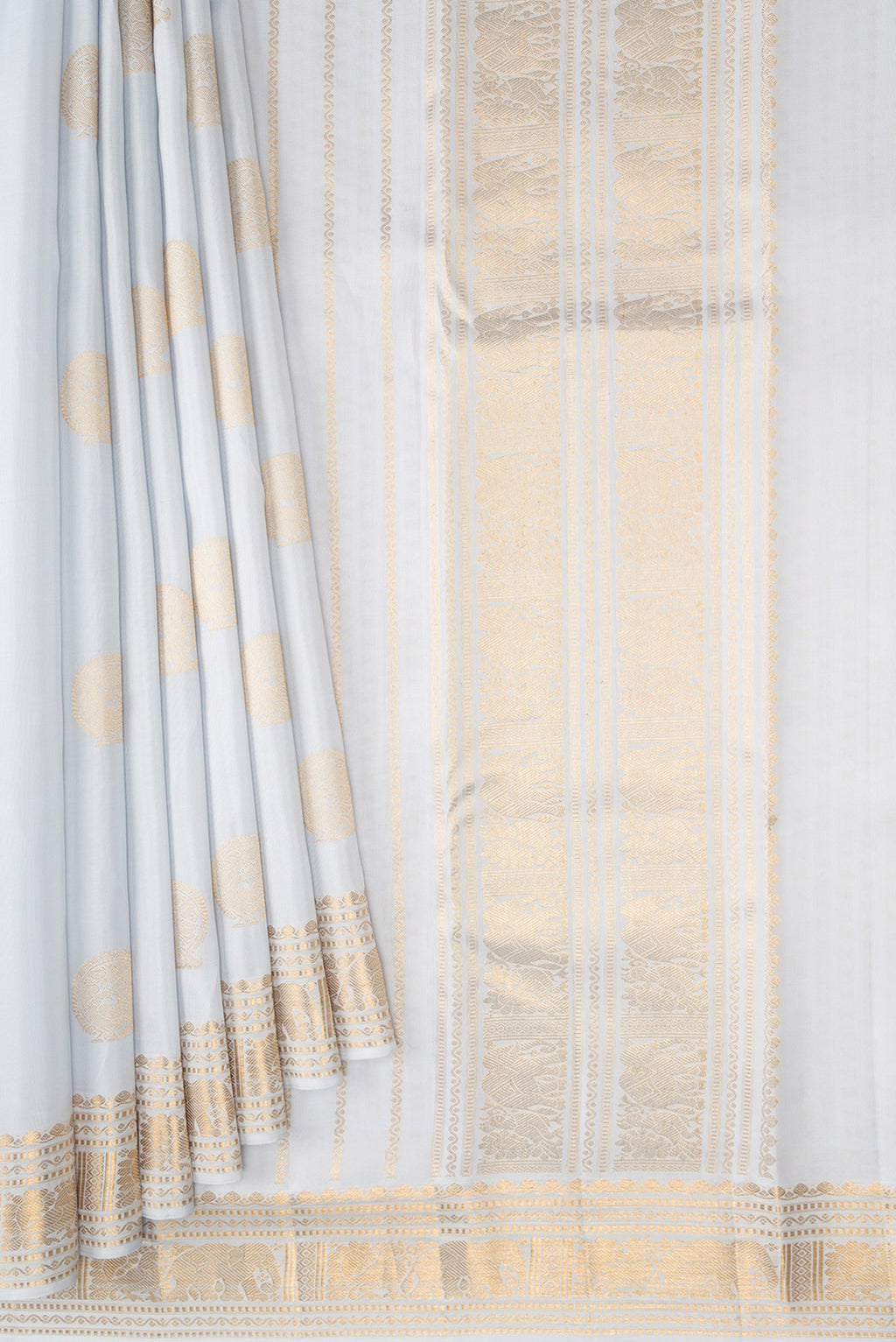 Pleats and pallu of Grey Kanjivaram Silk Saree with Zari Butta on the body and Zari Border. 