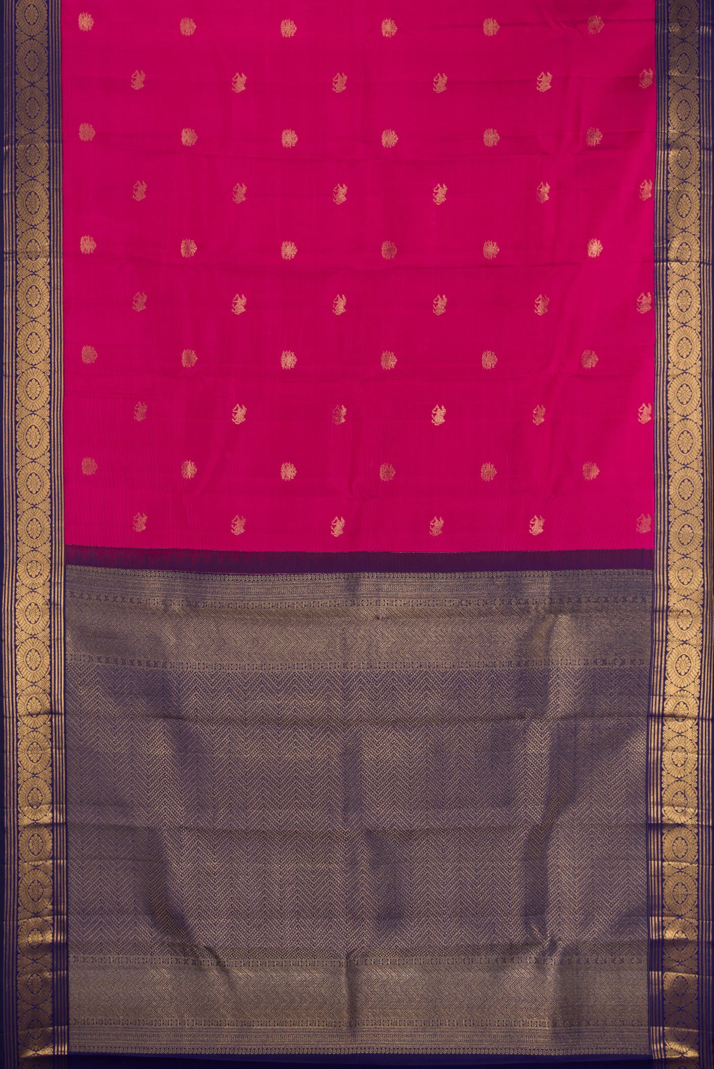 Flat view of Dark Pink Kanchipuram Silk Saree with Zari Butta on the body and Zari Border. 