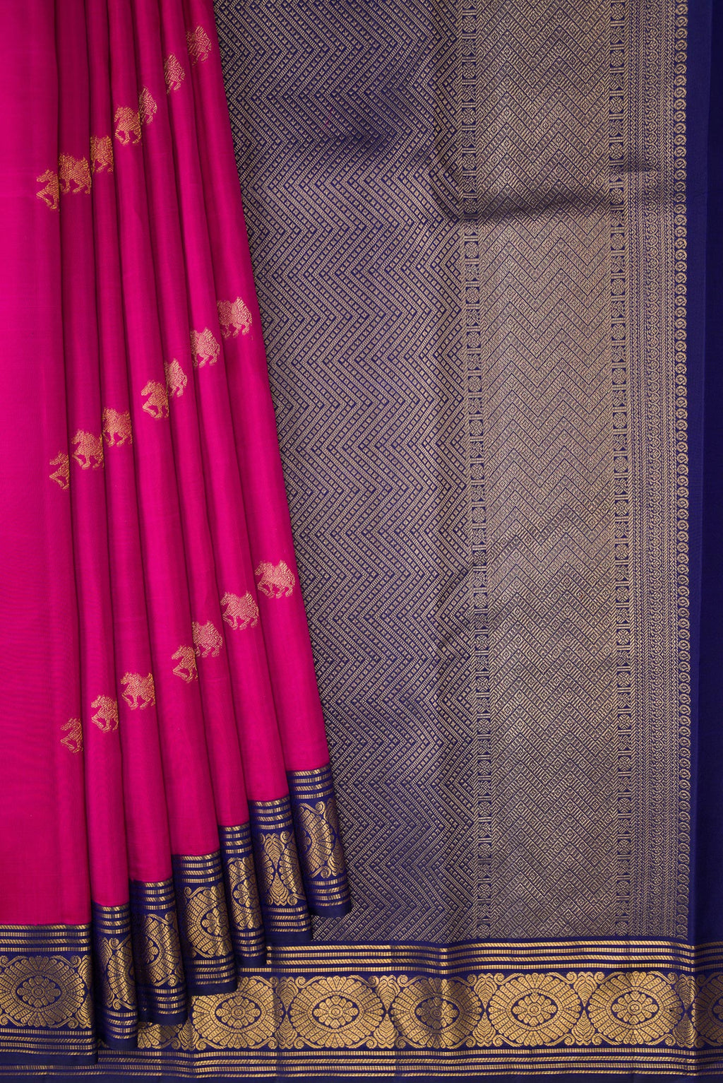 Pleats and pallu of Dark Pink Kanchipuram Silk Saree with Zari Butta on the body and Zari Border. 