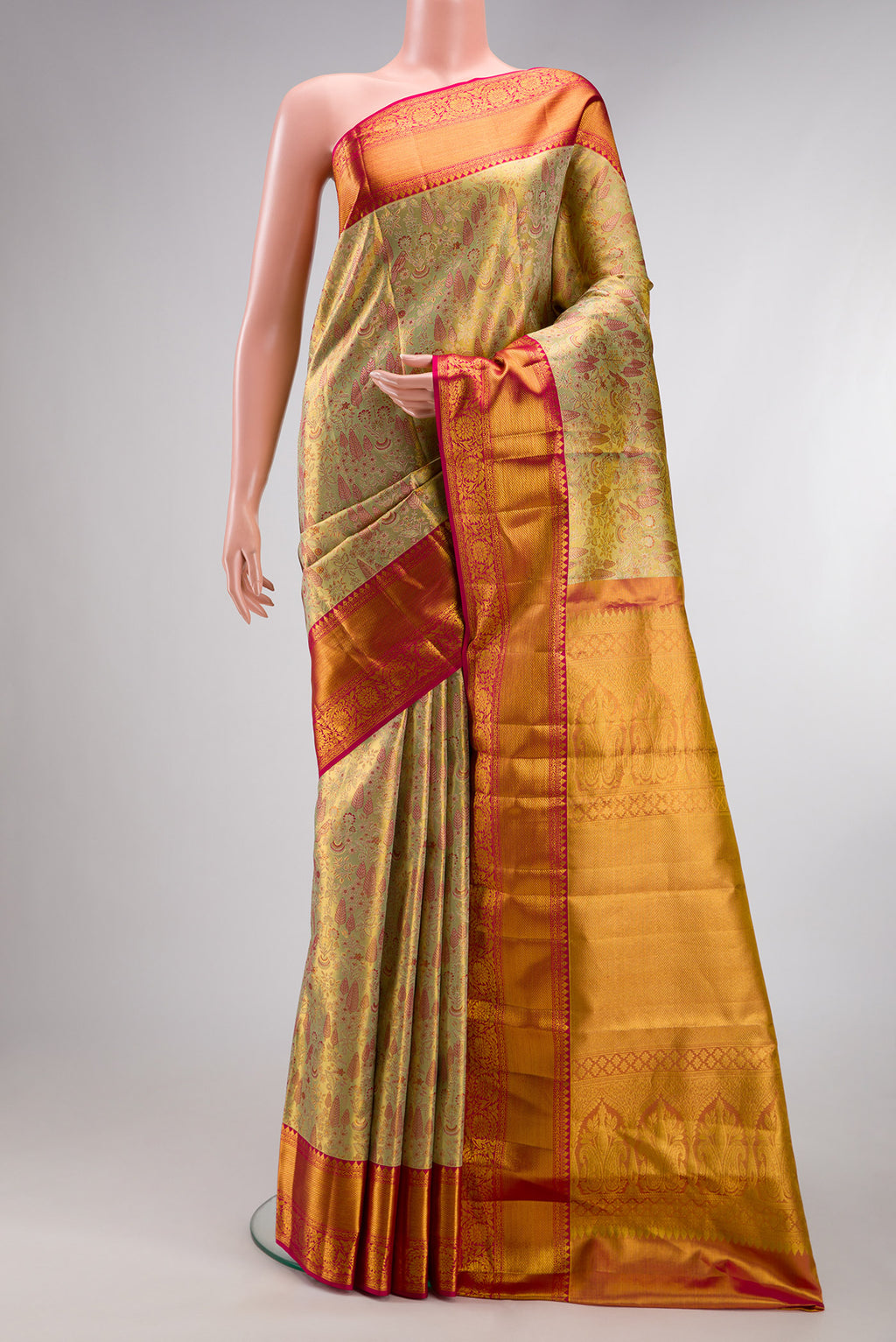 Pure Silk Gold Kanchipuram Tissue Saree with Zari Brocade on the body and Zari Border.  displayed on a mannequin