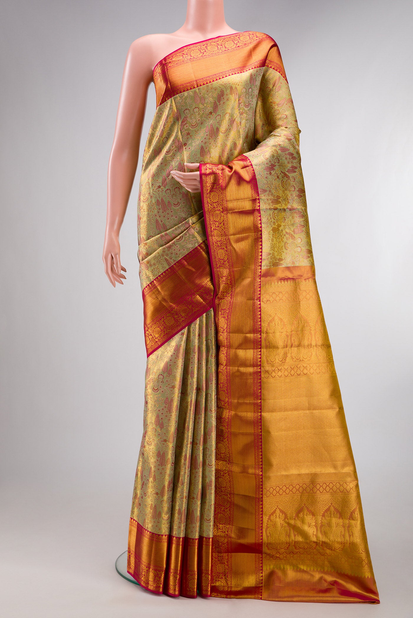 Pure Silk Gold Kanchipuram Tissue Saree with Zari Brocade on the body and Zari Border.  displayed on a mannequin