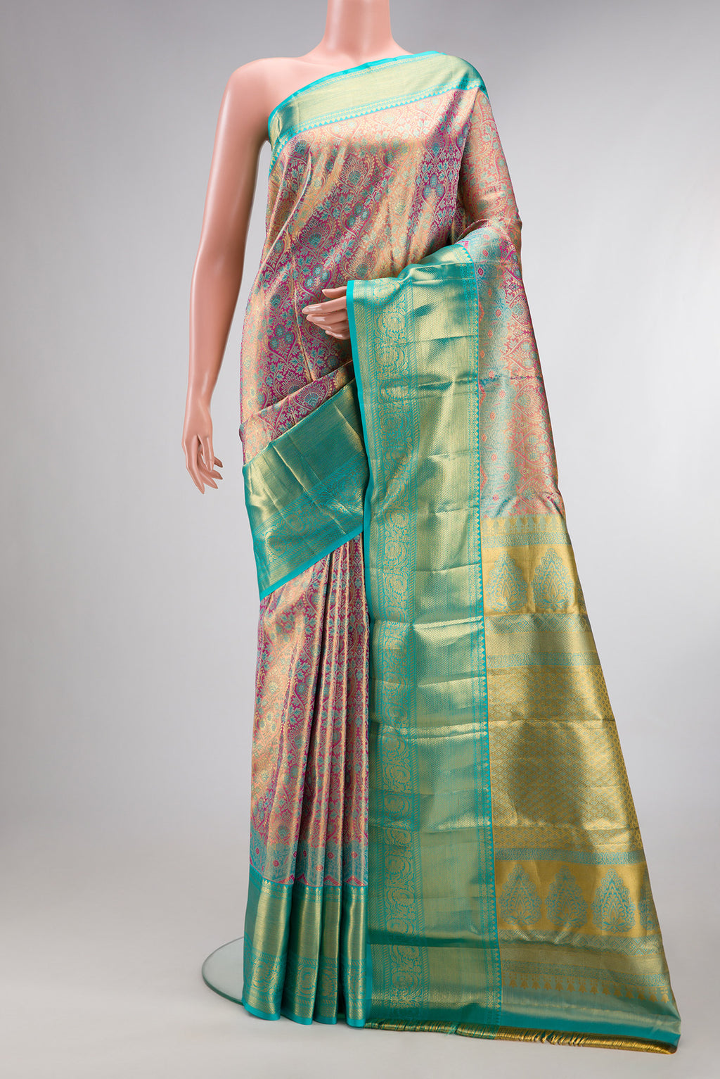 Pure Silk Pink Kanchipuram Tissue Saree with Zari Brocade on the body and Fancy Border.  displayed on a mannequin