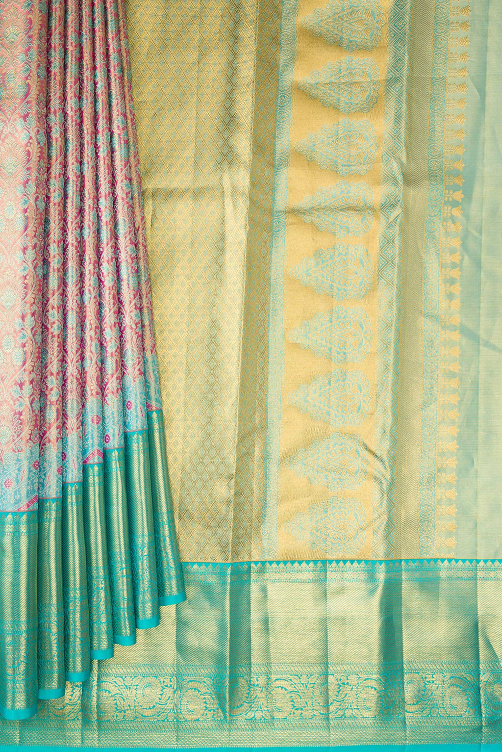 Pleats and pallu of Pure Silk Pink Kanchipuram Tissue Saree with Zari Brocade on the body and Fancy Border. 