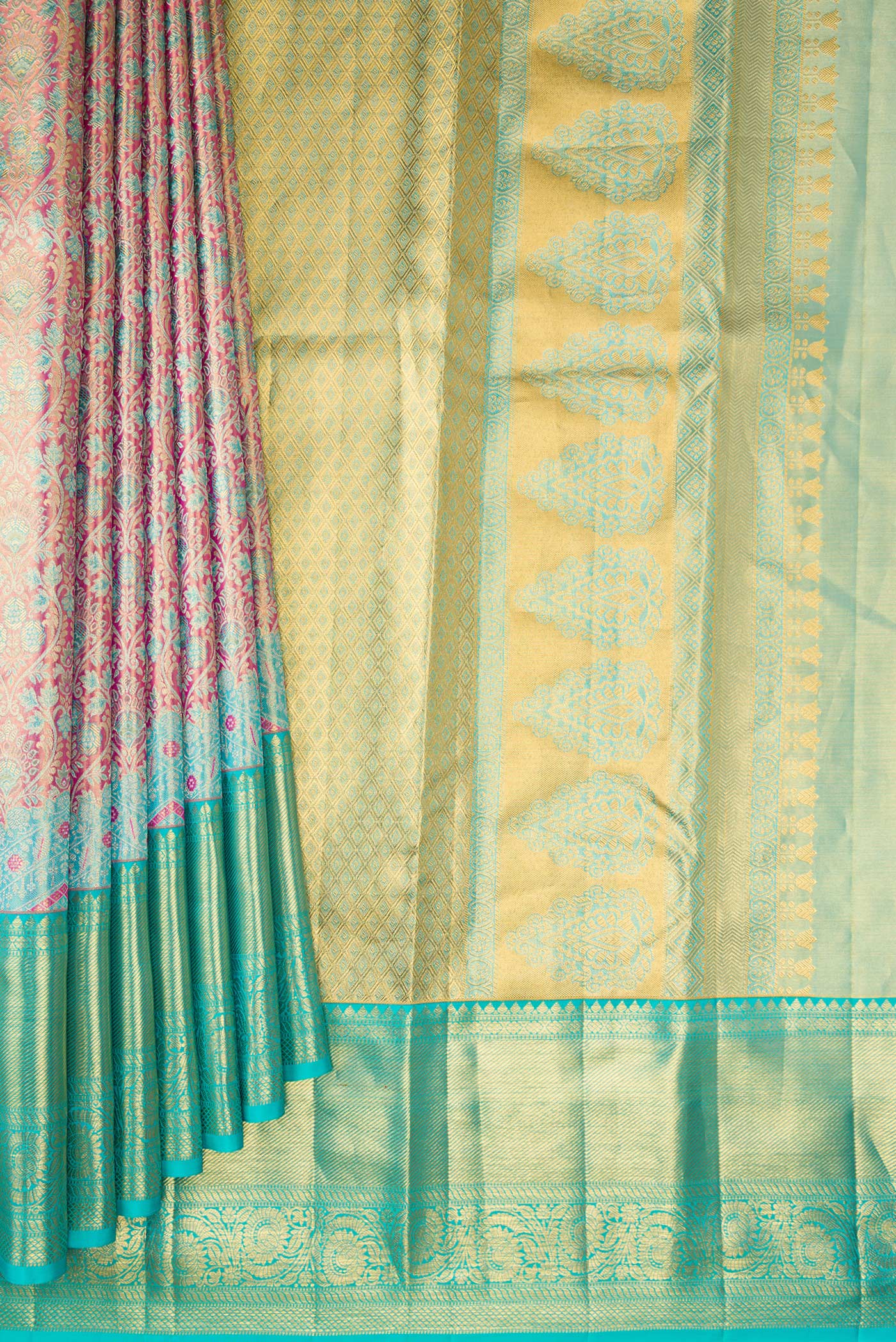 Pleats and pallu of Pure Silk Pink Kanchipuram Tissue Saree with Zari Brocade on the body and Fancy Border. 