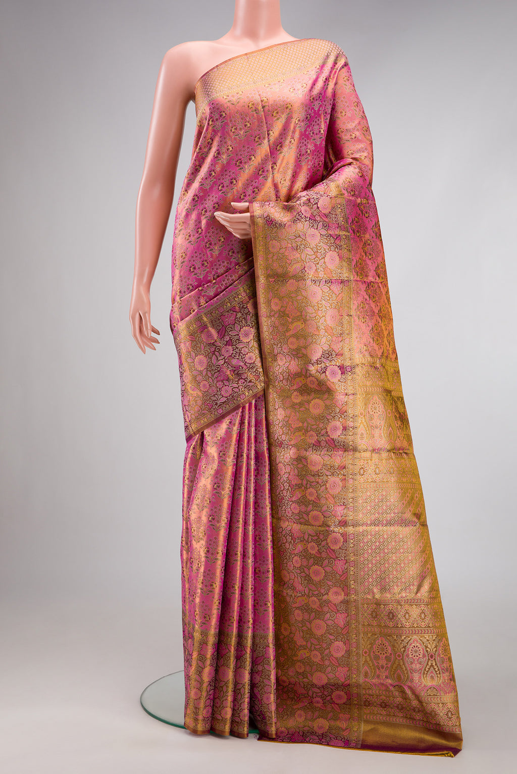 Pink Dual Tone Kanjivaram Tissue Silk Saree with Zari Brocade on the body and Fancy Border.  displayed on a mannequin