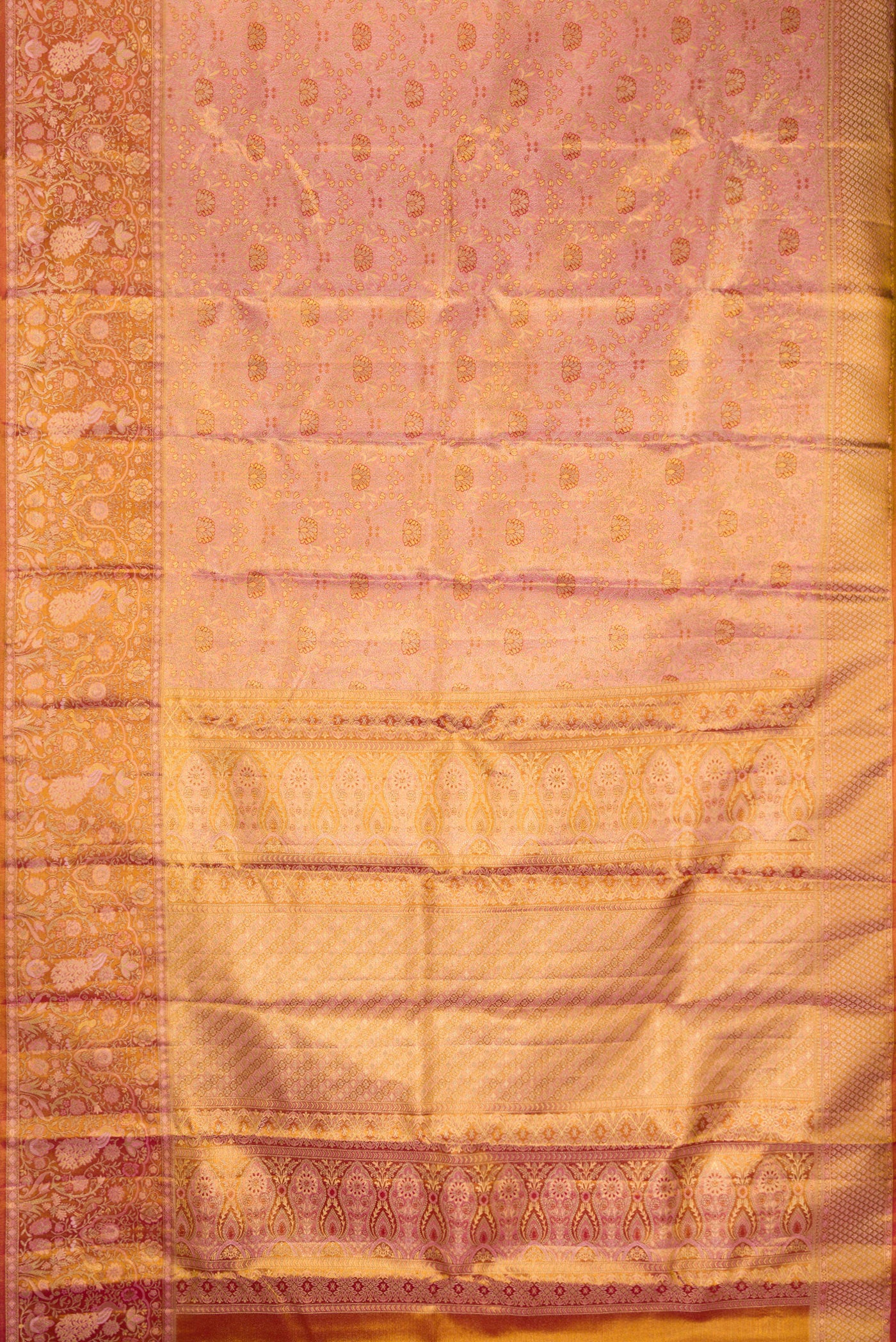 Flat view of Rose Gold Dual Tone Kanjivaram Tissue Silk Saree with Zari Brocade on the body and Fancy Border. 