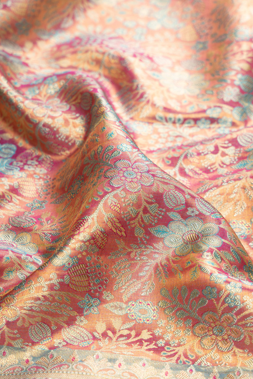Close up of Lavender Dual Tone Kanjivaram Tissue Silk Saree with Zari Brocade on the body and Fancy Border.  displaying folds
