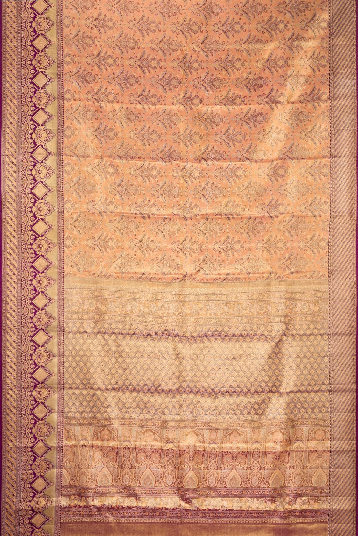 Flat view of Golden Peach Dual Tone Kanjivaram Tissue Saree with Zari Brocade on the body and Fancy Border. 