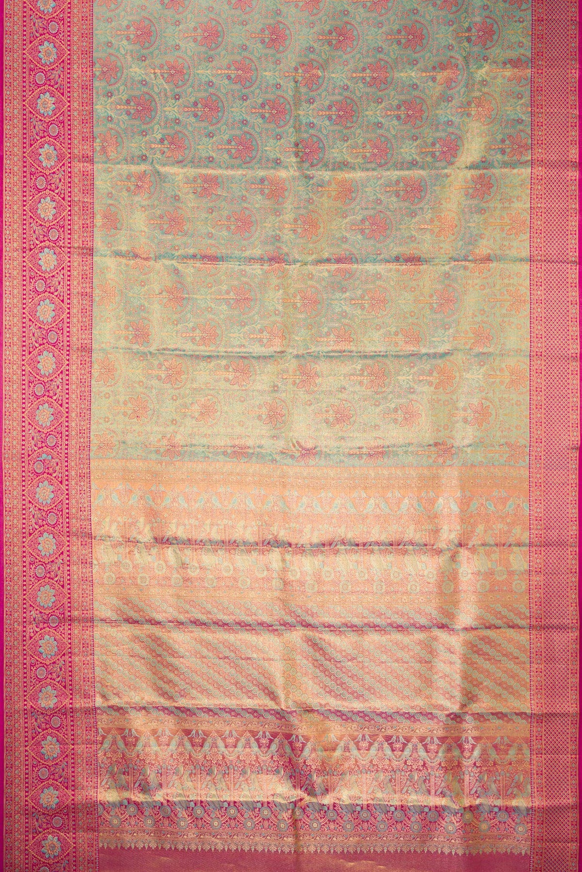 Flat view of Sea Green Dual Tone Kanjivaram Tissue Saree with Zari Brocade on the body and Fancy Border. 