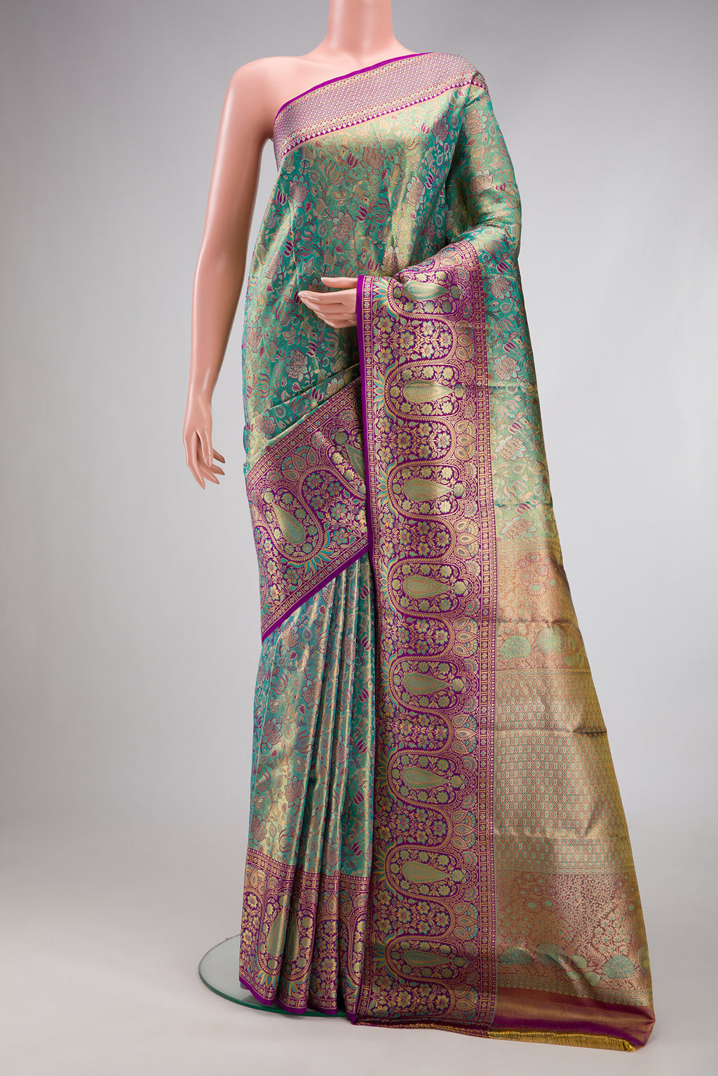 Turquoise Dual Tone Kanjivaram Tissue Silk Saree with Zari Brocade on the body and Fancy Border.  displayed on a mannequin