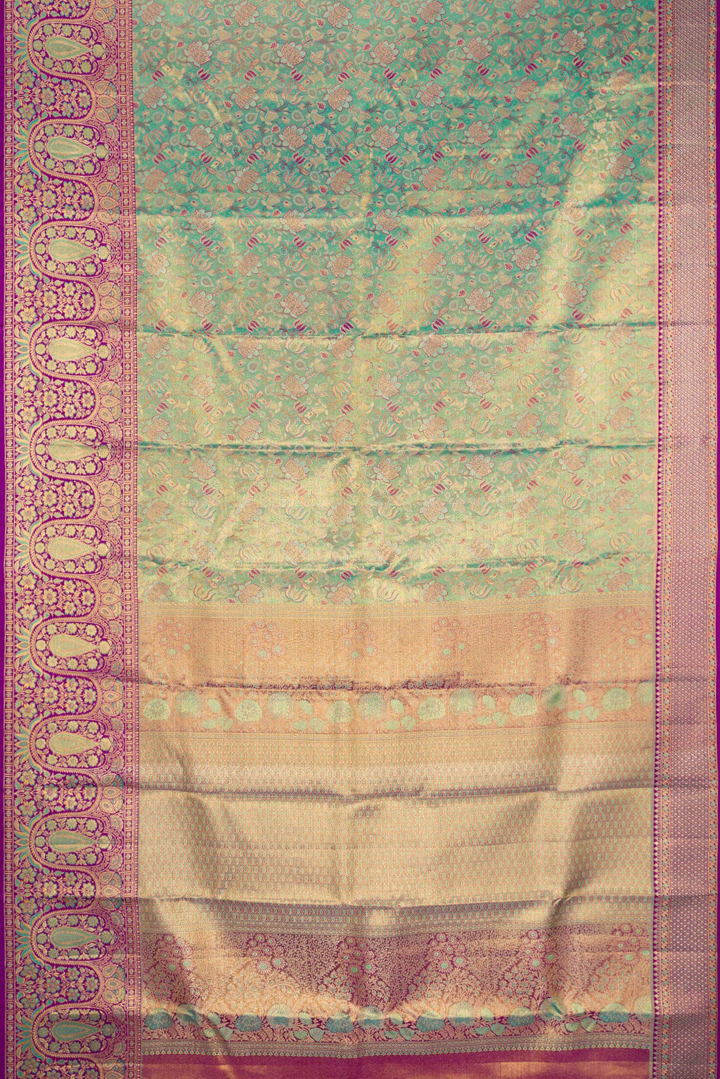 Flat view of Turquoise Dual Tone Kanjivaram Tissue Silk Saree with Zari Brocade on the body and Fancy Border. 
