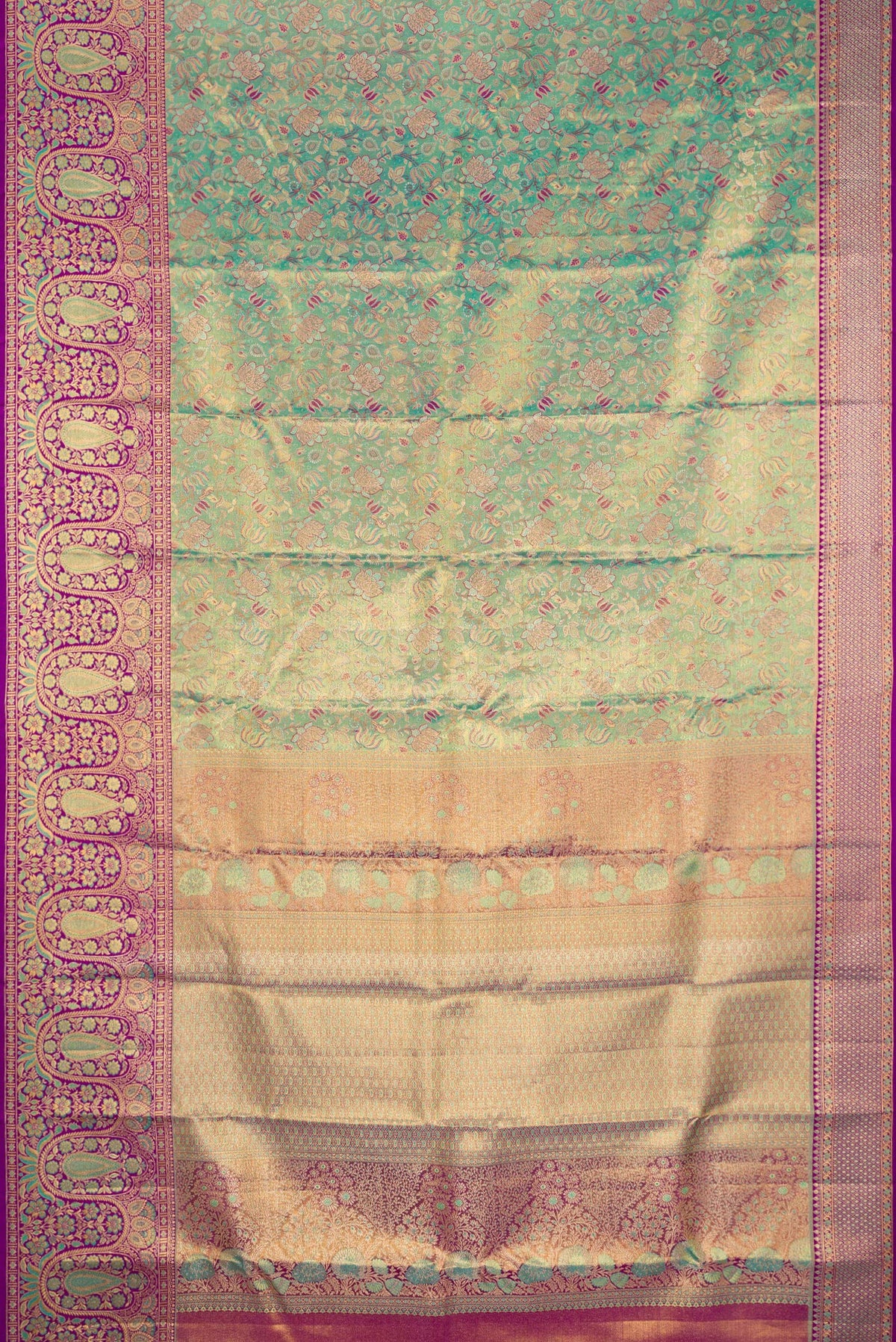 Flat view of Turquoise Dual Tone Kanjivaram Tissue Silk Saree with Zari Brocade on the body and Fancy Border. 