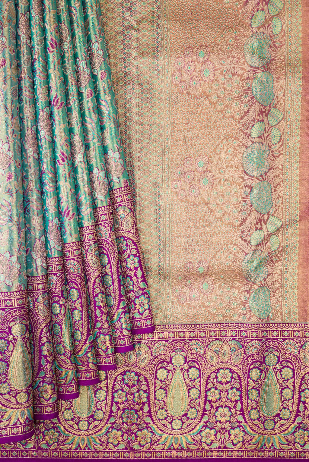 Pleats and pallu of Turquoise Dual Tone Kanjivaram Tissue Silk Saree with Zari Brocade on the body and Fancy Border. 