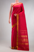 Maroon Kanchipuram Silk Saree with Stripes on the body and Zari Border.  displayed on a mannequin