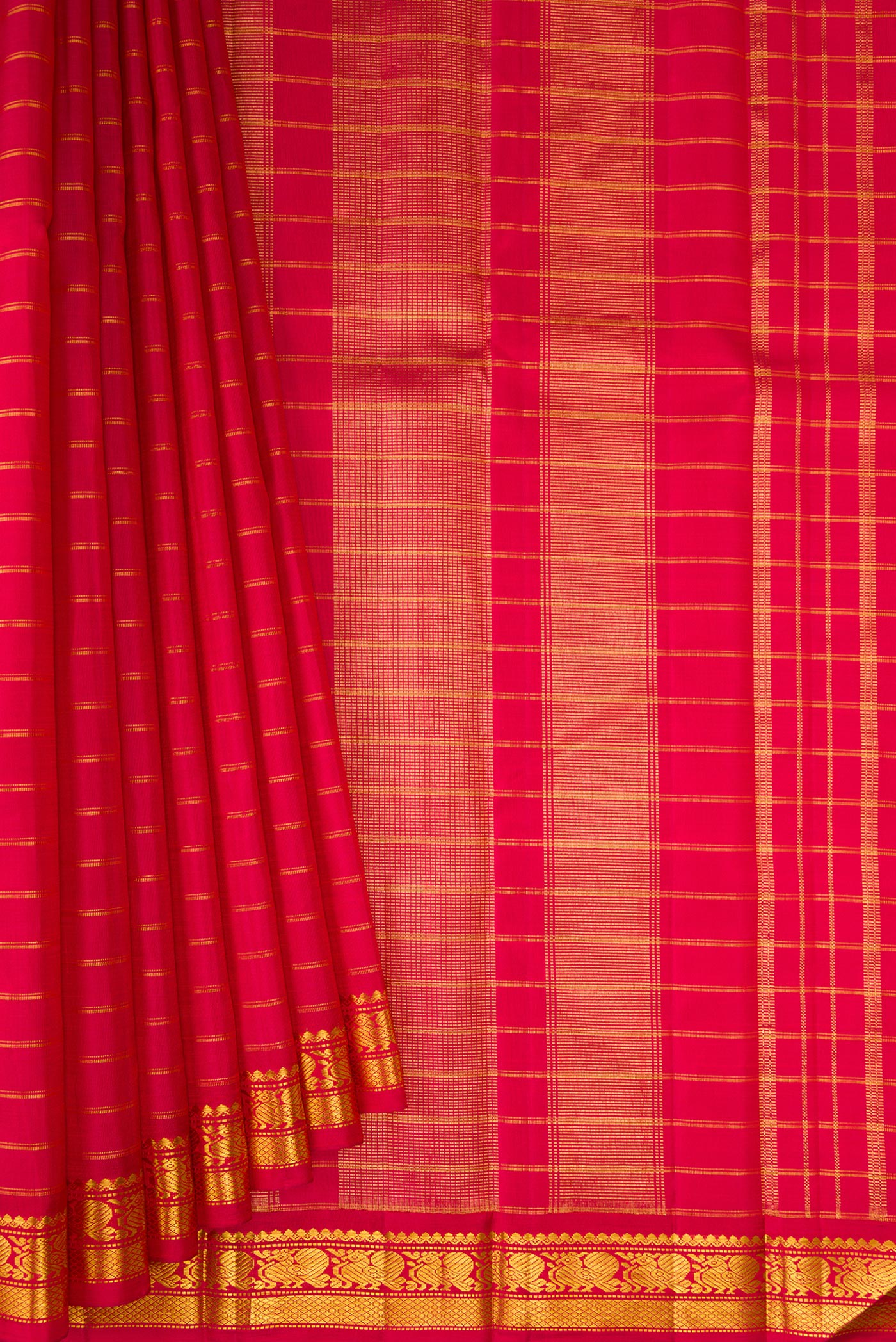 Pleats and pallu of Maroon Kanchipuram Silk Saree with Stripes on the body and Zari Border. 
