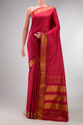 Pure Silk Maroon Kanchipuram Saree with Checked design on the body and Zari Border.  displayed on a mannequin