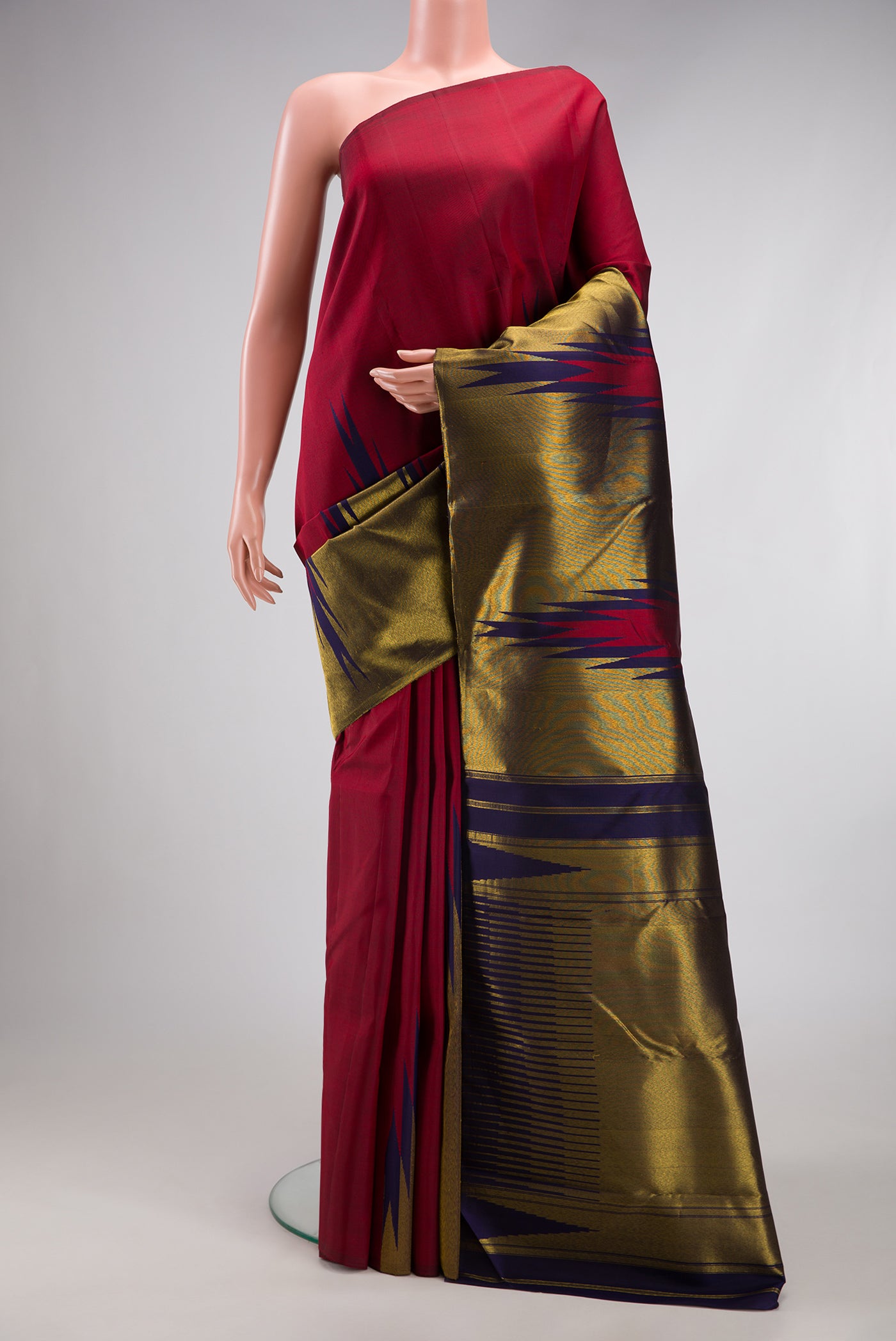 Maroon Kanjivaram Silk Saree with Plain Body and Temple Border.  displayed on a mannequin