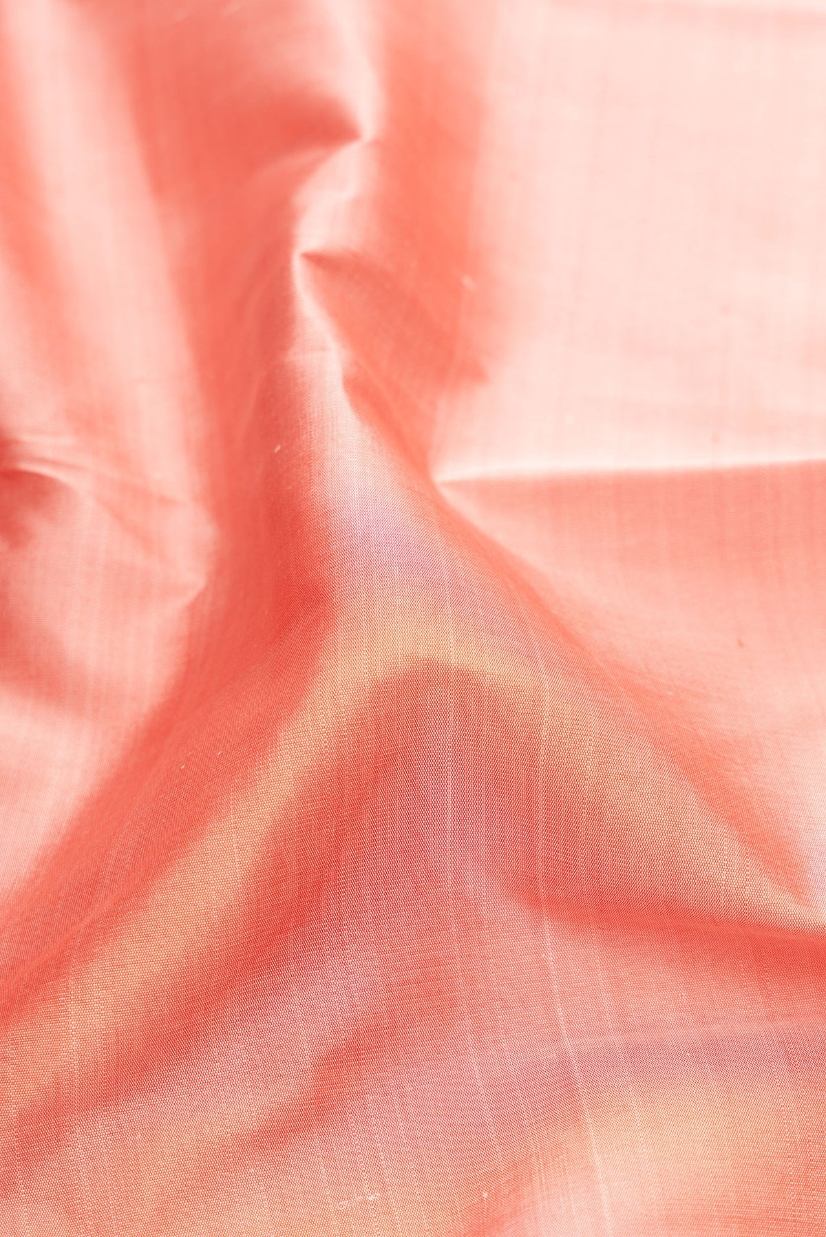 Close up of Rose pink Kanjivaram Silk Saree with Plain Body and Temple Border.  displaying folds