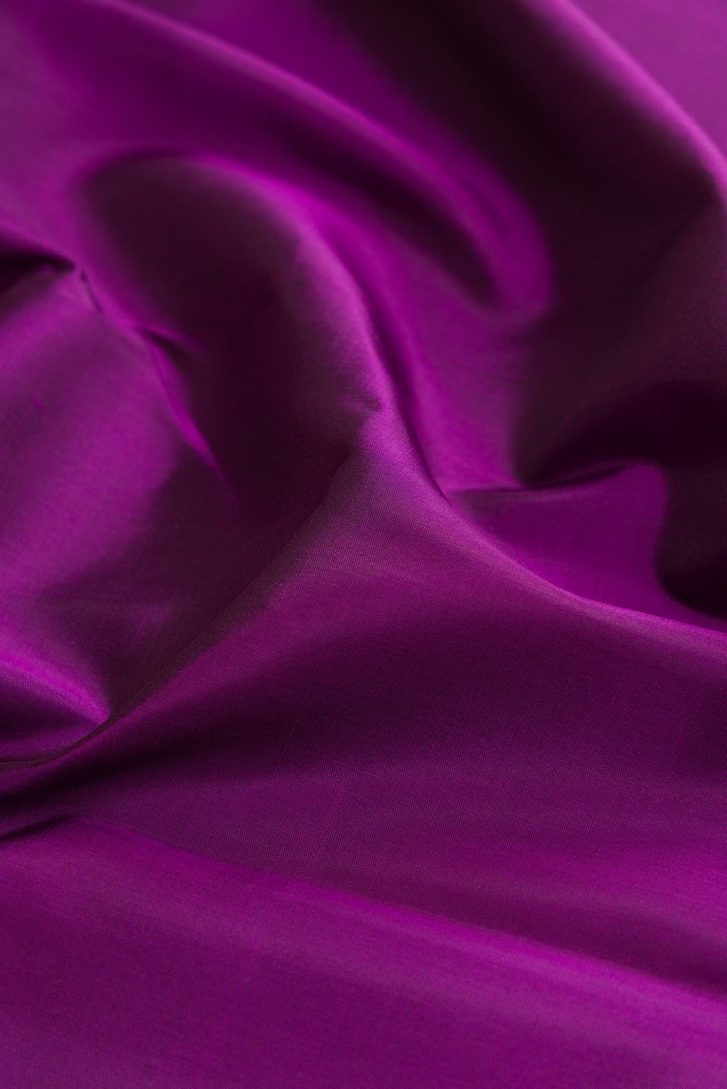Close up of Purple Kanjivaram Silk Saree with Plain Body and Temple Border.  displaying folds