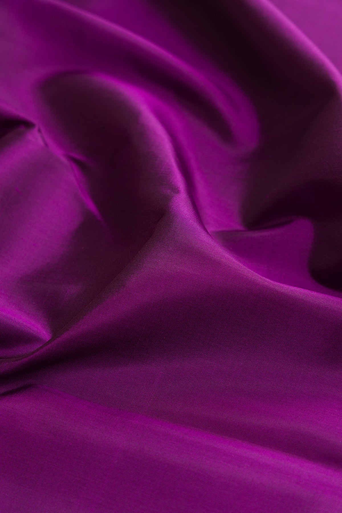 Close up of Purple Kanjivaram Silk Saree with Plain Body and Temple Border.  displaying folds