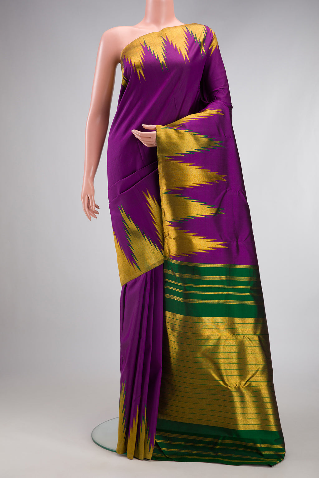 Purple Kanjivaram Silk Saree with Plain Body and Temple Border.  displayed on a mannequin