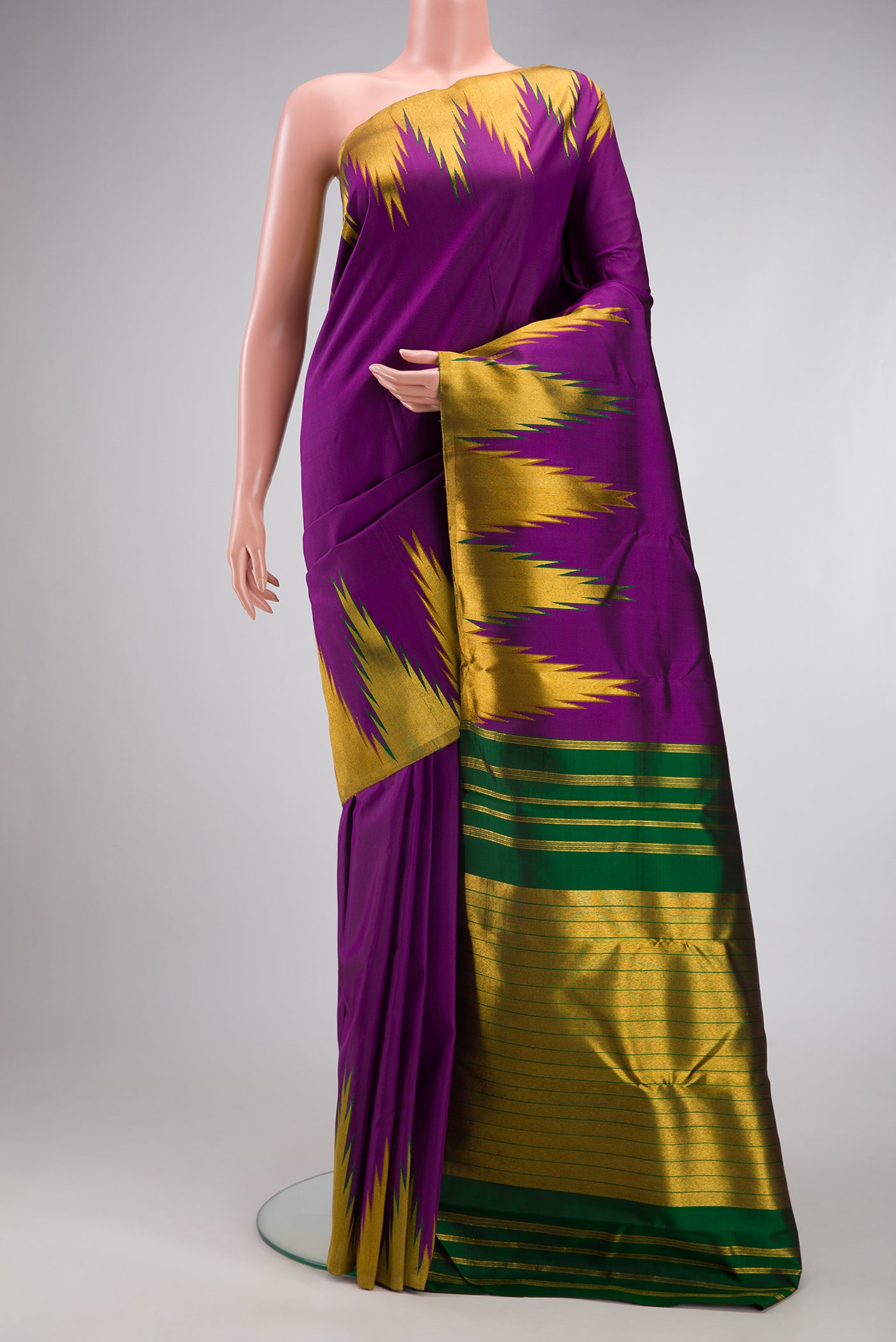 Purple Kanjivaram Silk Saree with Plain Body and Temple Border.  displayed on a mannequin