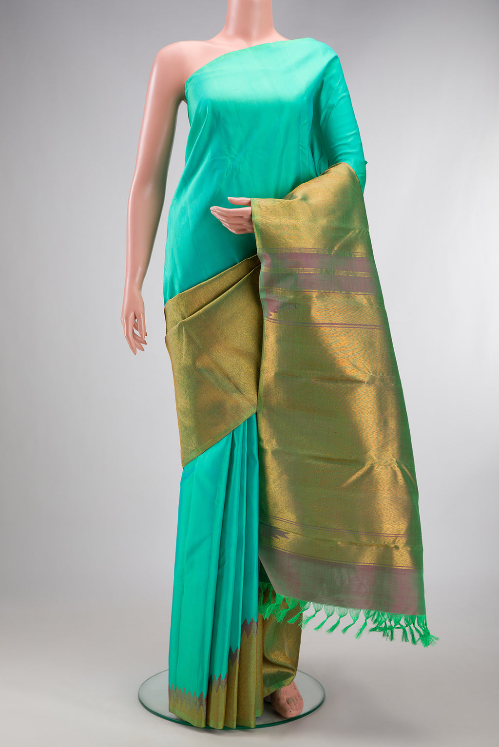 Sea Green Kanjivaram Silk Saree with Plain Body and Rising Temple Border.  displayed on a mannequin
