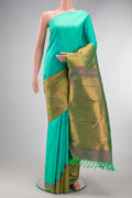 Sea Green Kanjivaram Silk Saree with Plain Body and Rising Temple Border.  displayed on a mannequin