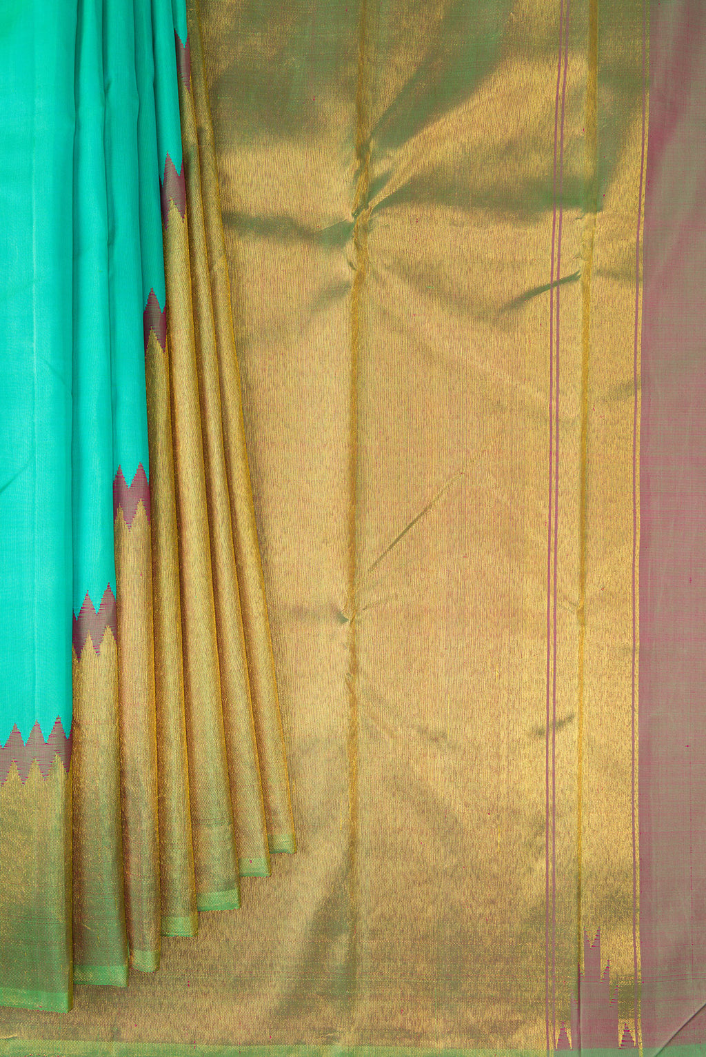 Pleats and pallu of Sea Green Kanjivaram Silk Saree with Plain Body and Rising Temple Border. 