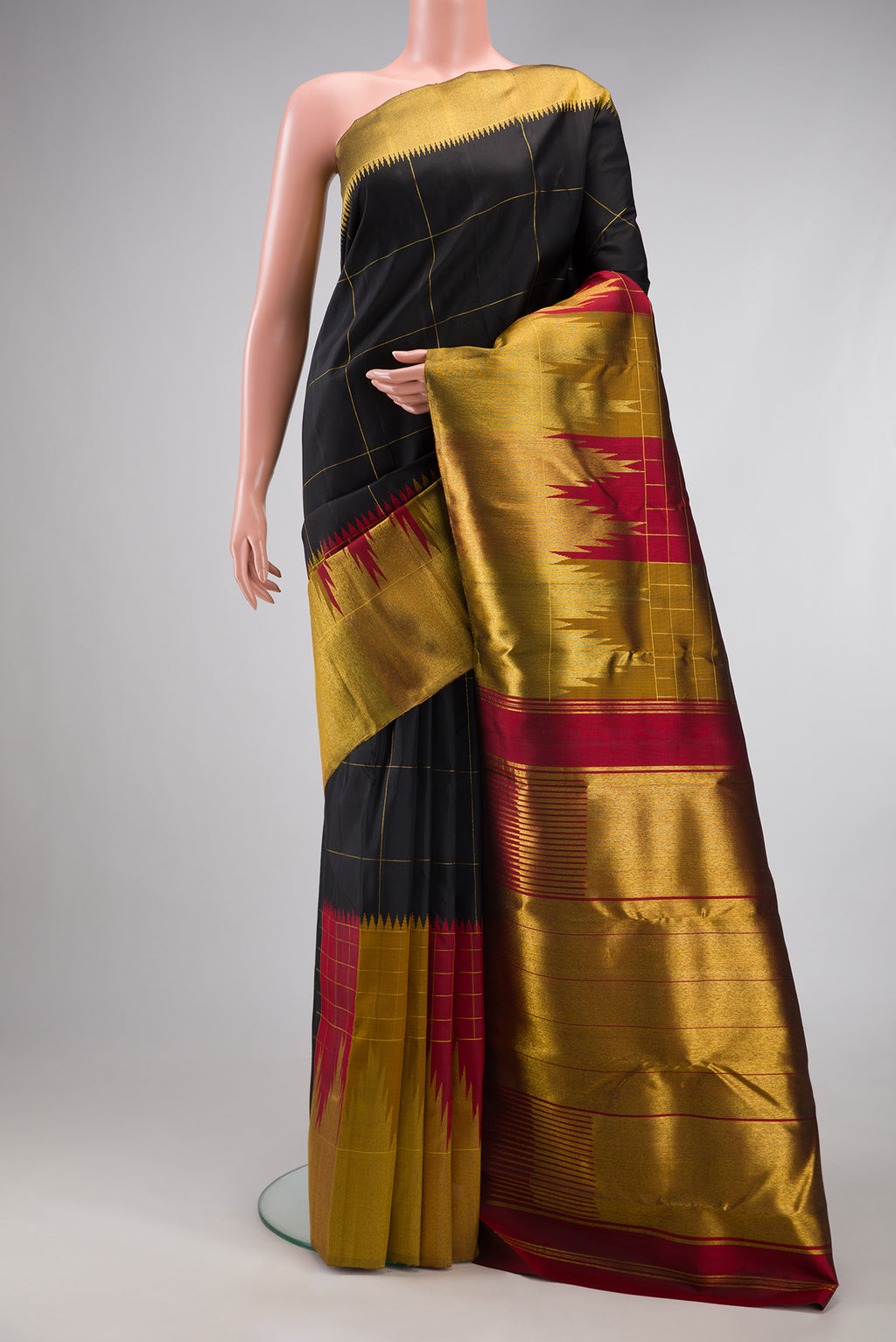 Black Kanchipuram Silk Saree with Checked design on the body and Fancy Border.  displayed on a mannequin