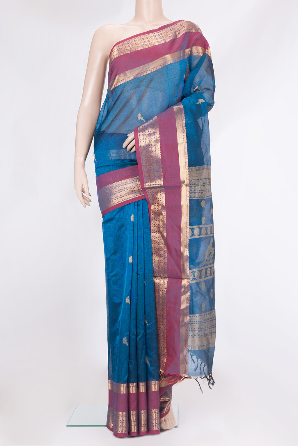 Peacock Blue Dual Tone Silk Cotton Saree with Zari Butta on the body and Zari Border.  displayed on a mannequin
