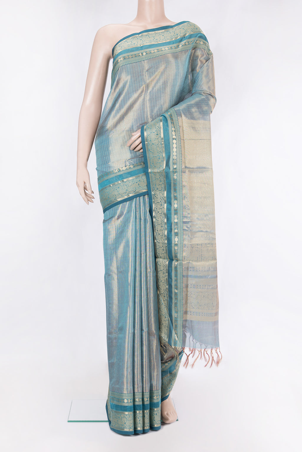 Peacock Blue Dual Tone Silk Cotton Saree with Checked design on the body and Zari And Thread Border.  displayed on a mannequin