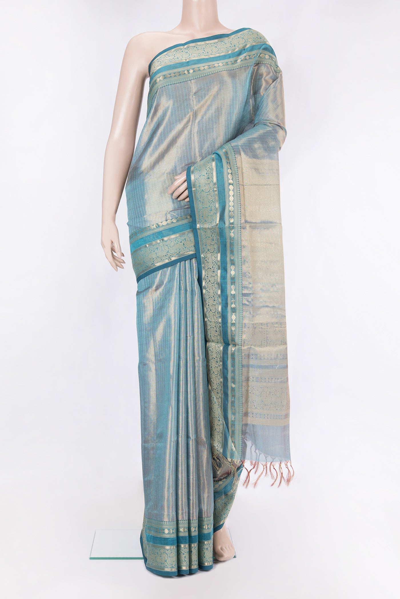 Peacock Blue Dual Tone Silk Cotton Saree with Checked design on the body and Zari And Thread Border.  displayed on a mannequin