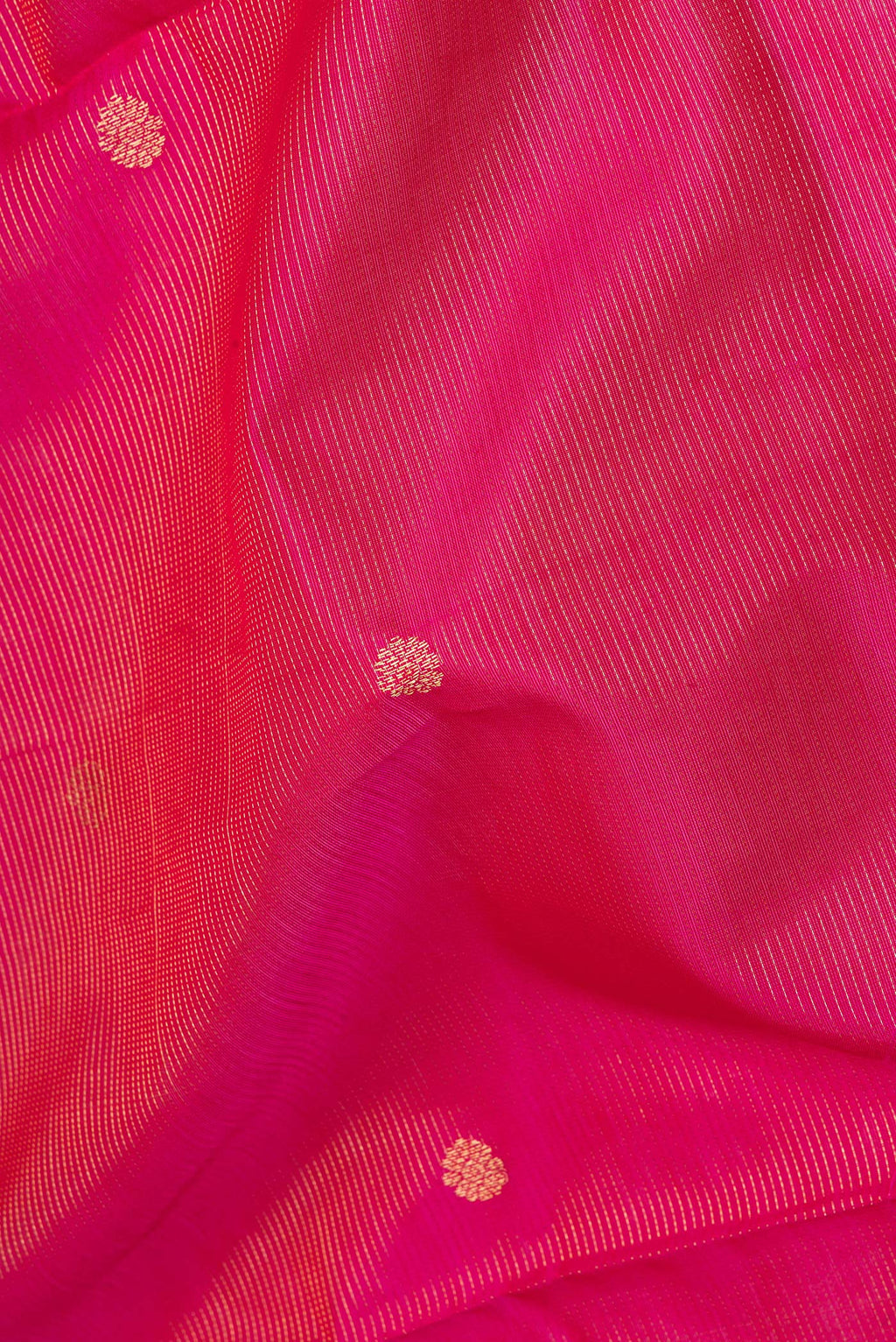 Close up of Dark Pink Silk Cotton Saree with Stripes on the body and Zari Border.  displaying folds