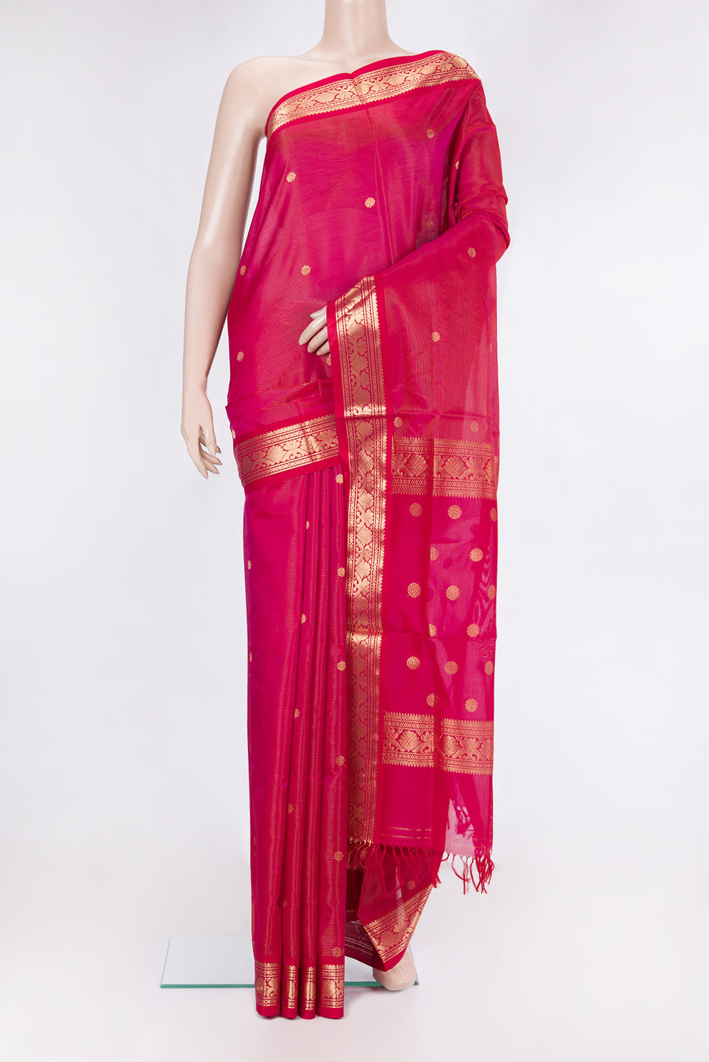 Dark Pink Silk Cotton Saree with Stripes on the body and Zari Border.  displayed on a mannequin
